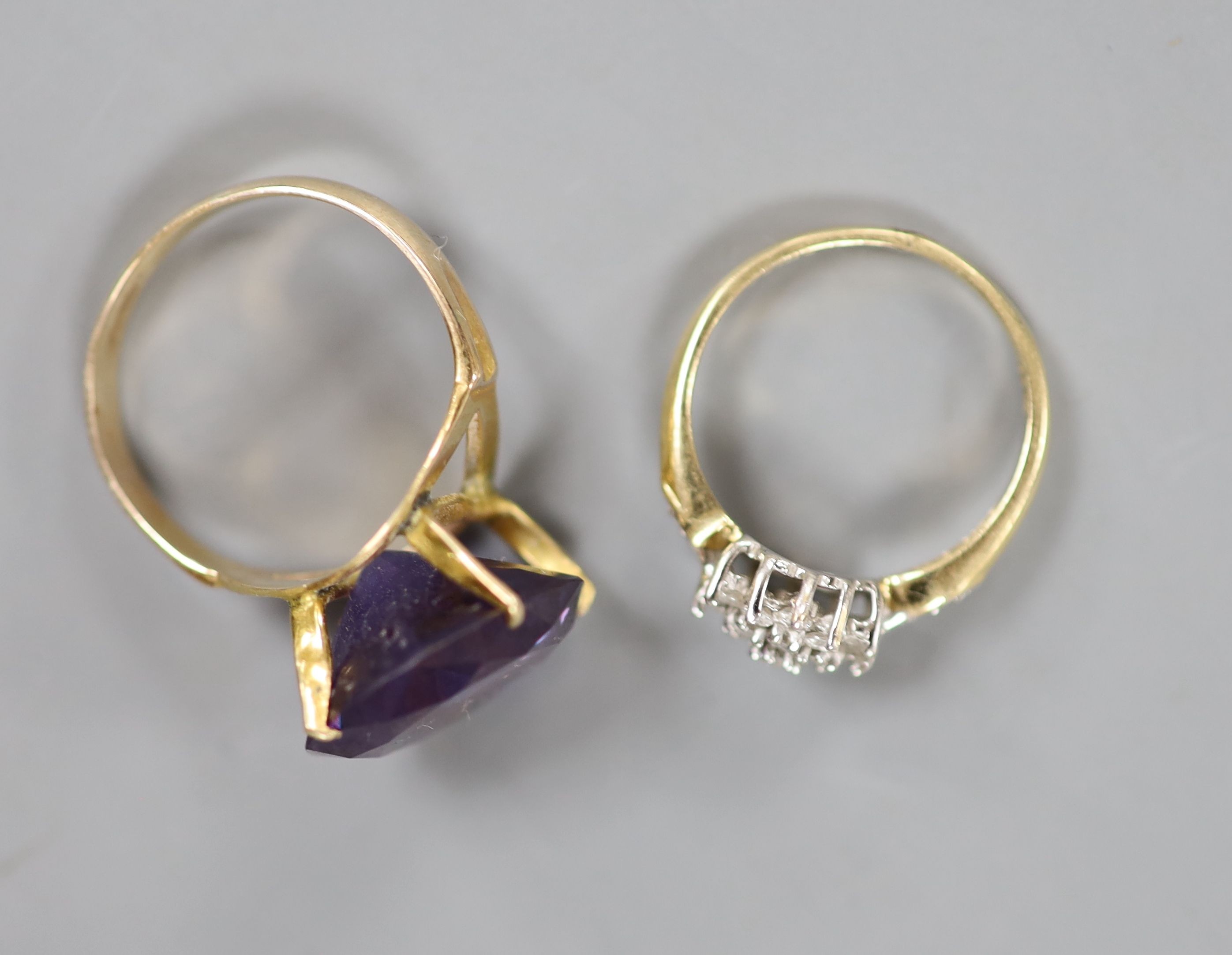 Two 14k and gem set rings and a pair of ear studs